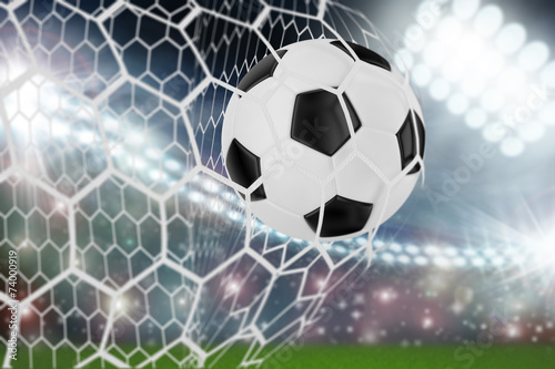 soccer ball in goal net