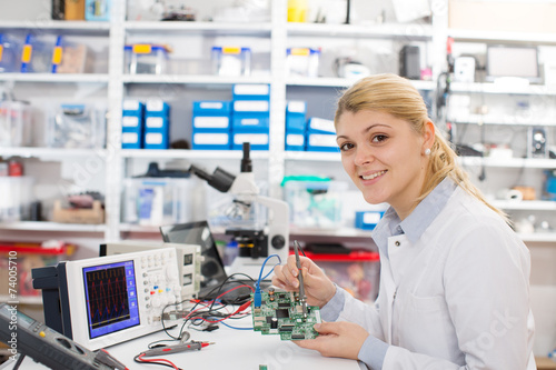 girl student studying electronic device with a microprocessor