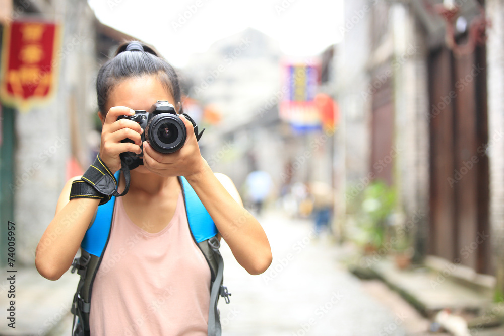 young woman photographer taking photo,yangshuo,china