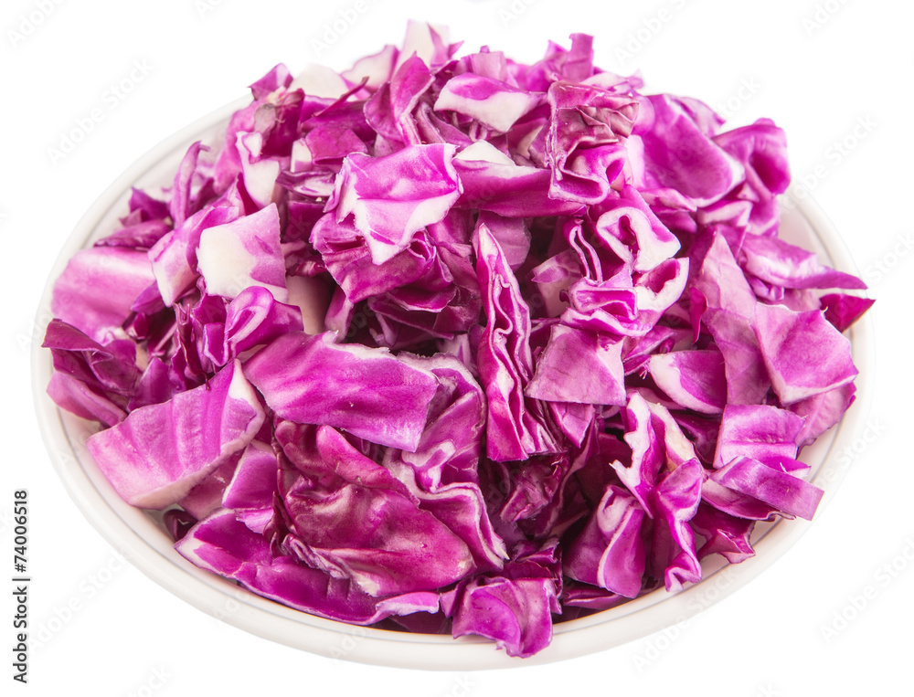 Chopped red cabbages in white bowl over white background