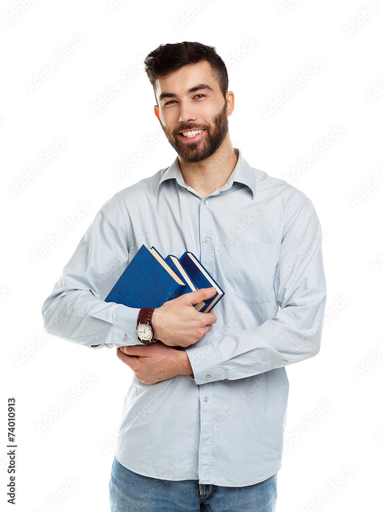 Young bearded smiling man with books in hands on white Young bearded smiling man with books in hands on white
