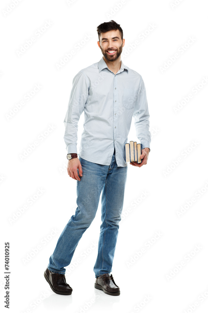 Young bearded smiling man with books in hands on white Young bearded smiling man with books in hands on white