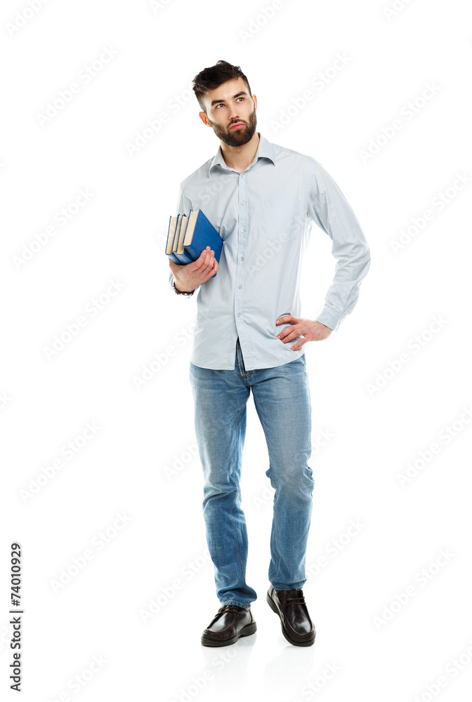 Young bearded smiling man with books in hands on white Young bearded smiling man with books in hands on white