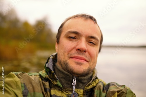 Self Portrait of the happy man suit of color khaki