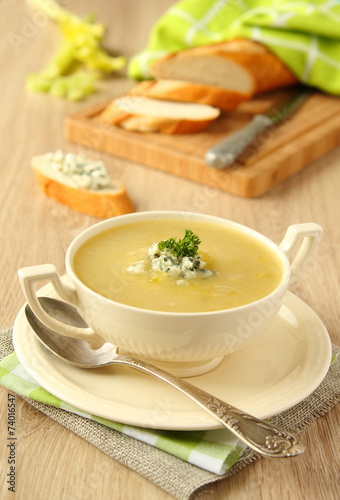 Homemade onion soup with celery and blue cheese