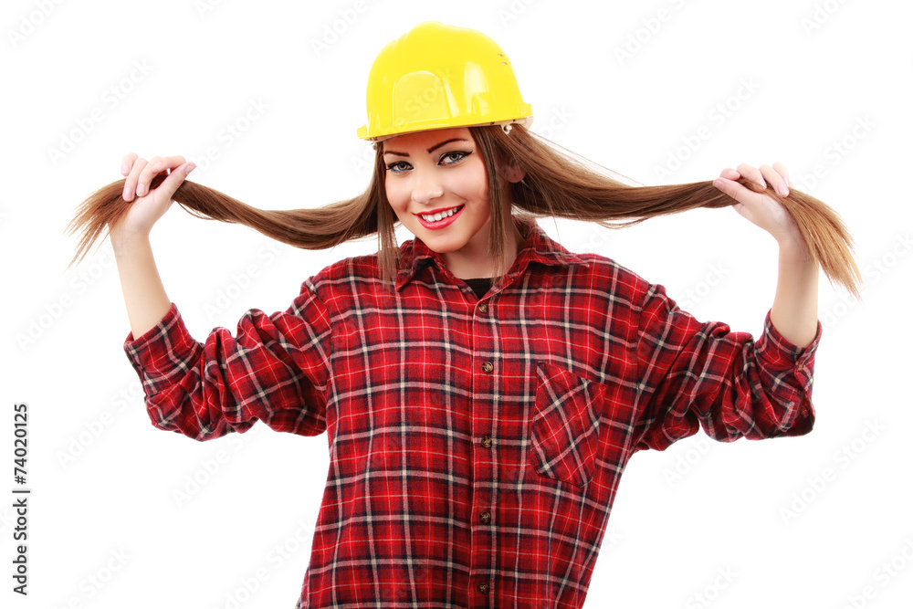 Young female architect or builder wearing a yellow hart hat on a Young female architect or builder wearing a yellow hart hat on a