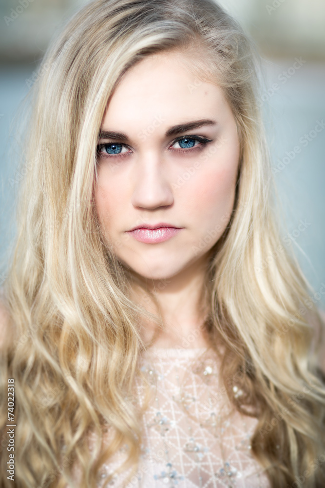 Fototapeta premium Beautiful Blond Teenage Girl With Blue Eyes