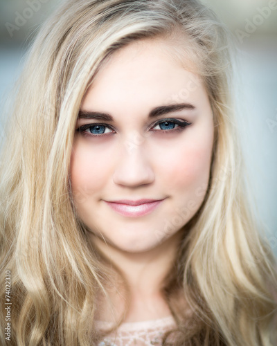 Beautiful Blond Teenage Girl With Blue Eyes