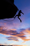Climber grips the edge.