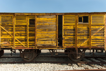 Fotobehang Trein Oude treinwagon op verlaten spoor  © STOCKSTUDIO