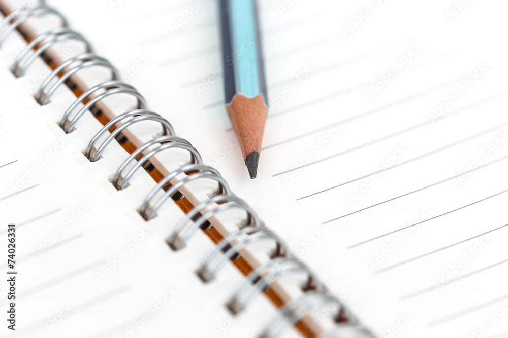 closeup of blank notebook and pencil for text or background closeup of blank notebook and pencil for text or background
