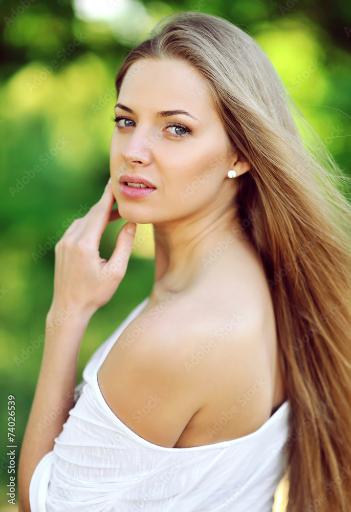 Portrait of happy smiling beautiful young woman touching skin Portrait of happy smiling beautiful young woman touching skin