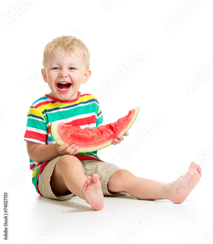 Little boy eating watermelo...