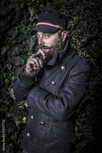 portrait of a stylish man with beard, hipster sailor style