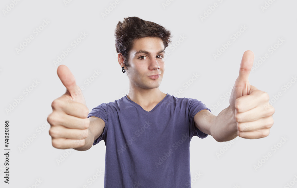 happy young man with thums up, funny face expression happy young man with thums up, funny face expression