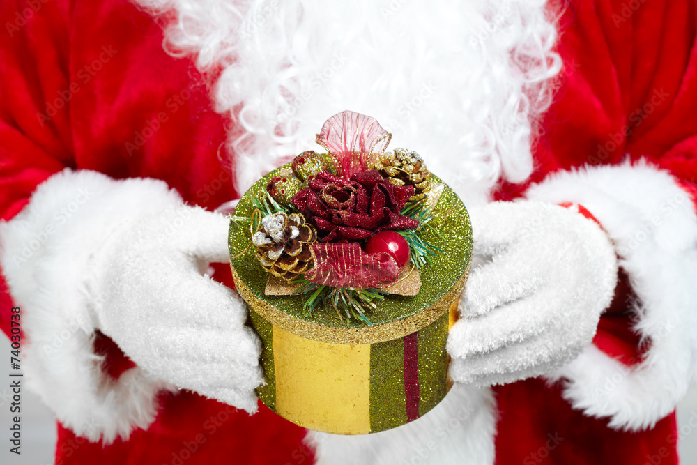 Hands of Santa Claus with gift Hands of Santa Claus with gift