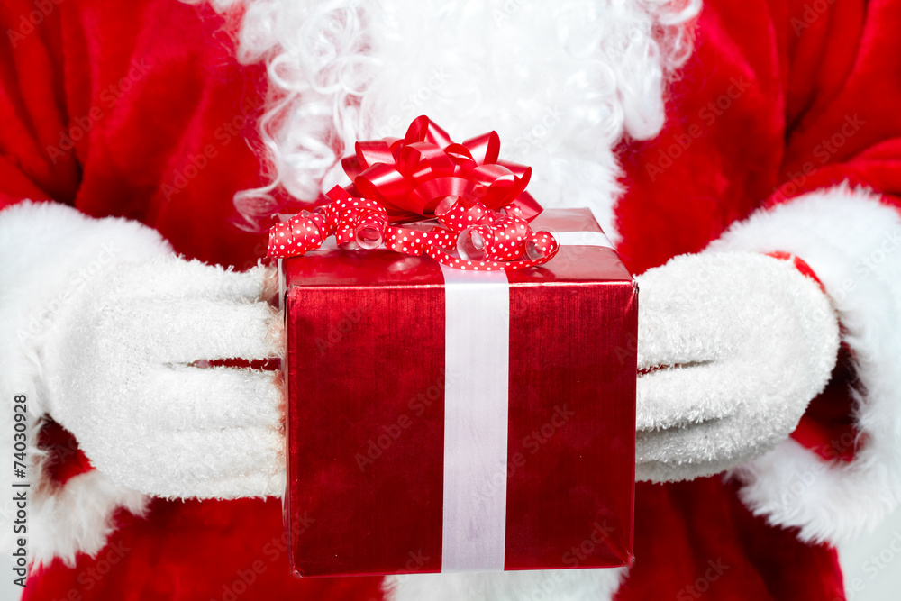Hands of Santa Claus with gift Hands of Santa Claus with gift