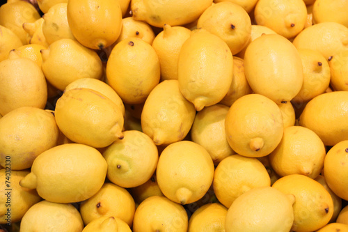 Colorful of lemons display in market