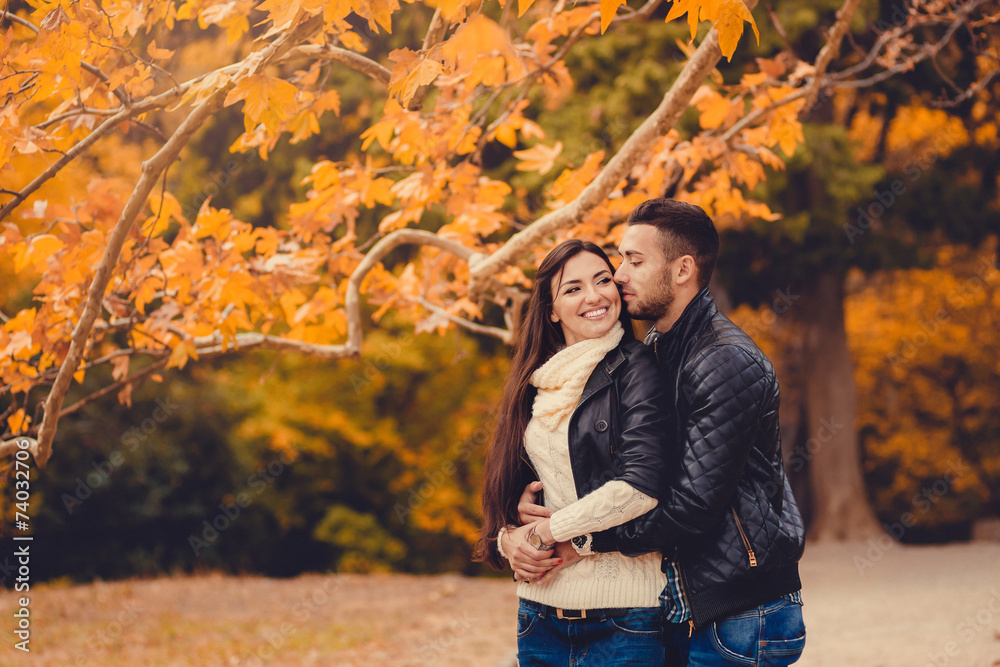 Young couple in autumn park Young couple in autumn park