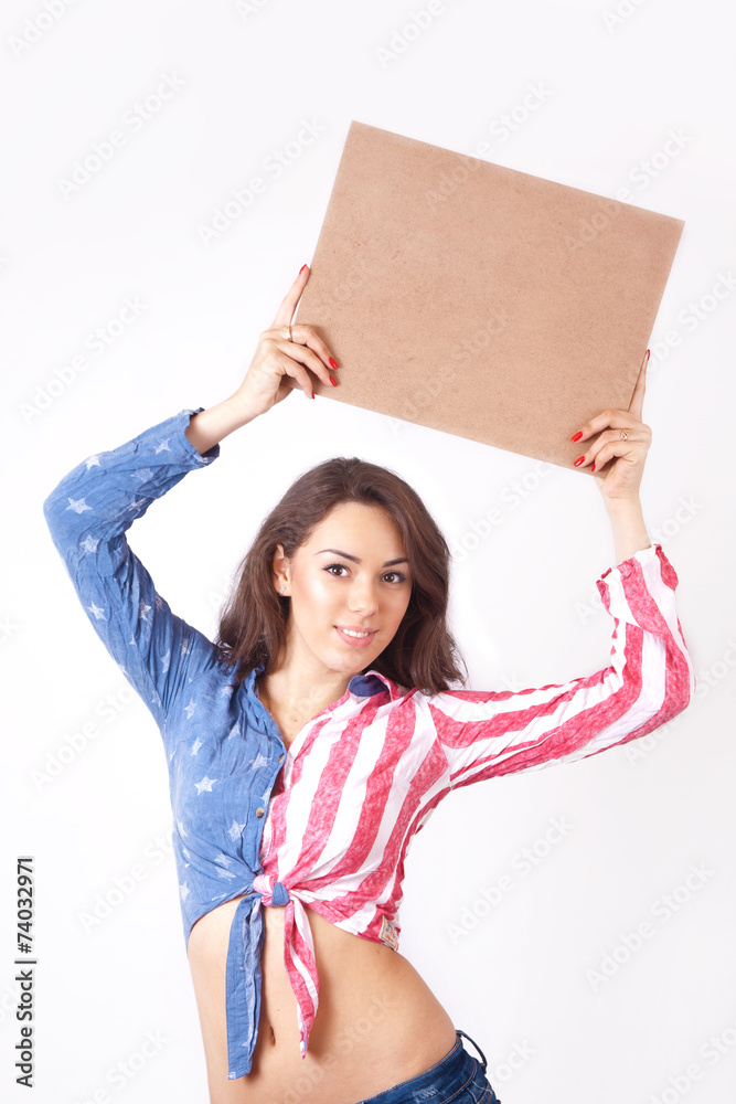 Cute smiling girl with a sign in his hands Cute smiling girl with a sign in his hands