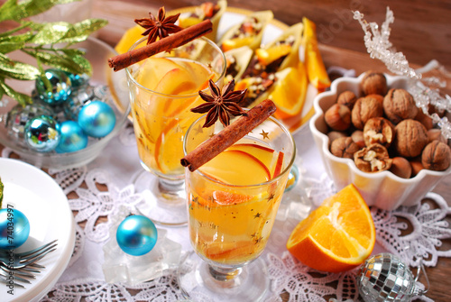 apple and orange drink with spices for christmas