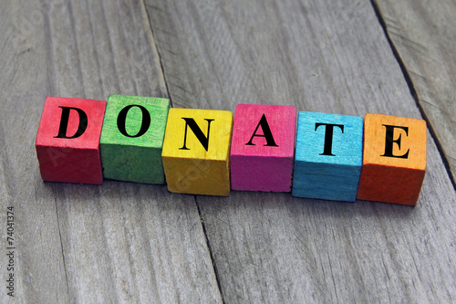 concept of donation word on wooden cubes