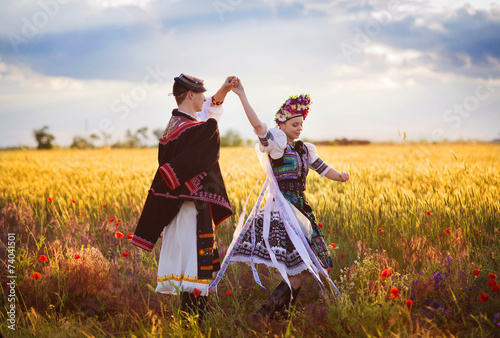 Love couple is dancing in the field photo