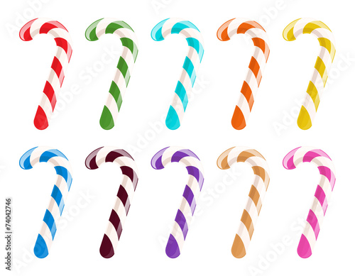 Set of colorful candy canes on white background.