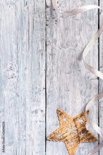 Light blue painted wooden texture with Christmas star