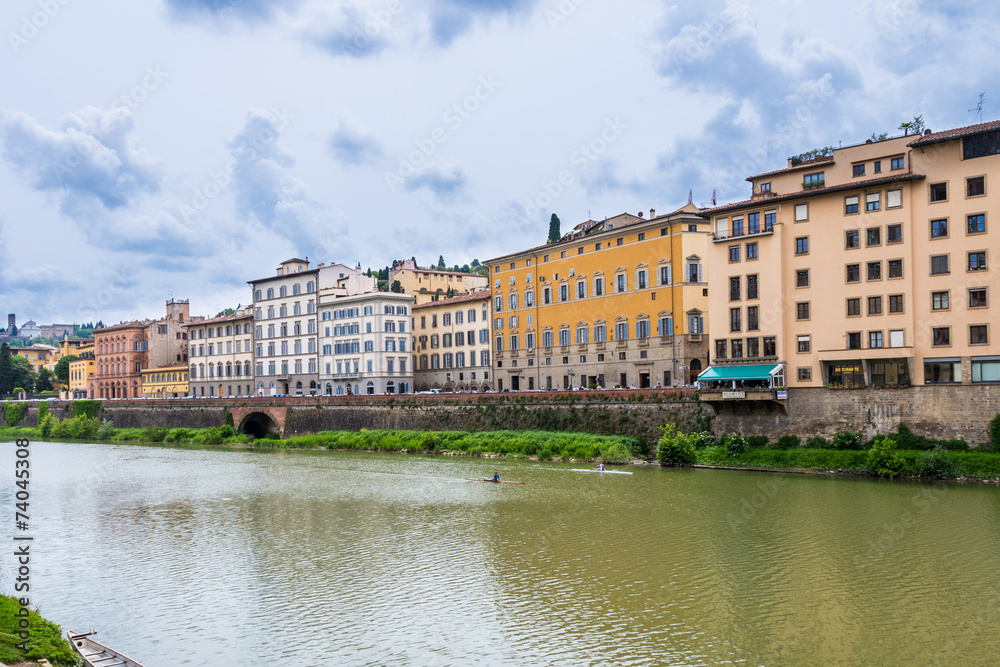 Glimpse of Arno river at  Ponte Vecchio in Florence on a cloudy