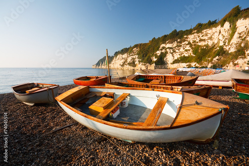 Boats on the beach in Beer, Devon, UK
