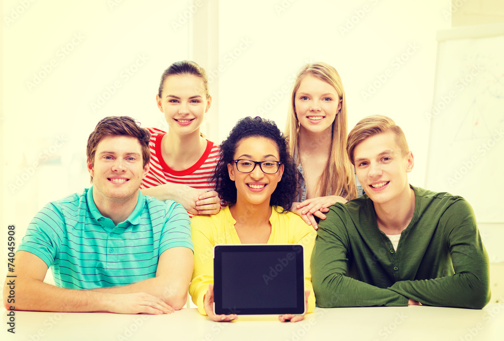smiling students showing tablet pc blank screen smiling students showing tablet pc blank screen
