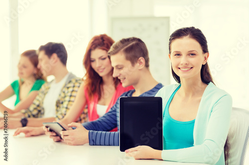 smiling students with tablet pc at school
