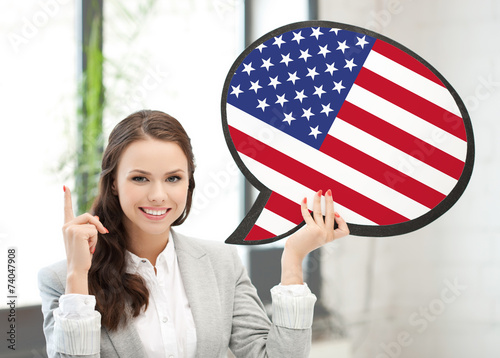 smiling woman with text bubble of american flag