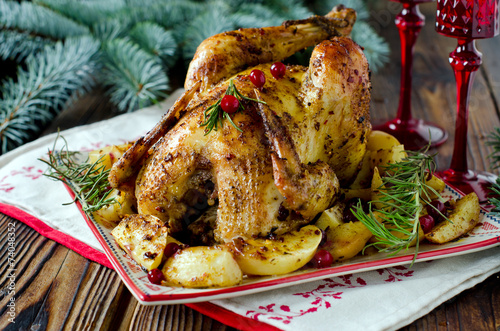 Christmas chicken baked with potatoes and cranberries