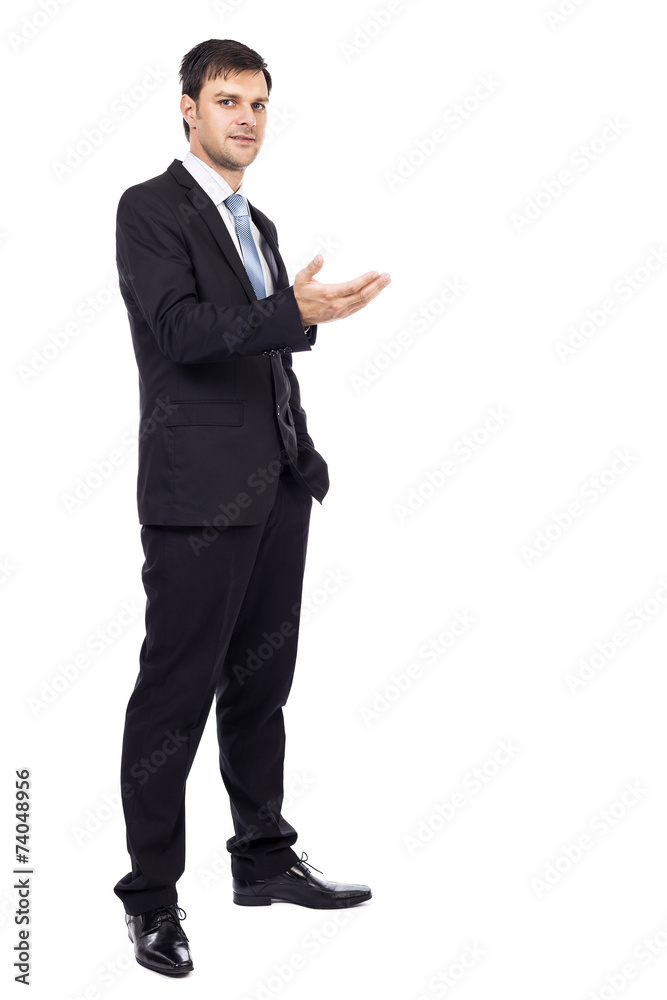 Handsome young businessman making welcome gesture Handsome young businessman making welcome gesture
