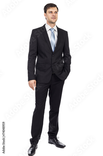 Full lenght portrait of happy young business man with hand in hi