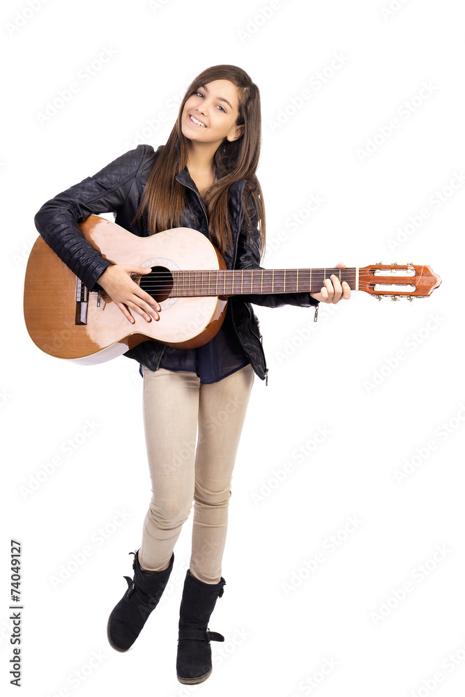 Portrait of happy teenager playing guitar