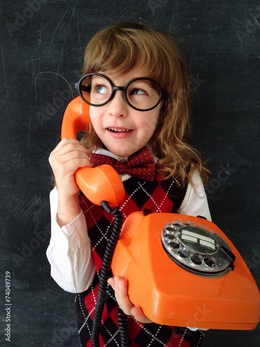 child speaking by the phone