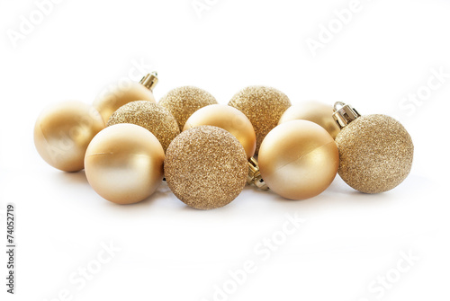 Gold Christmas ball decorations on white background