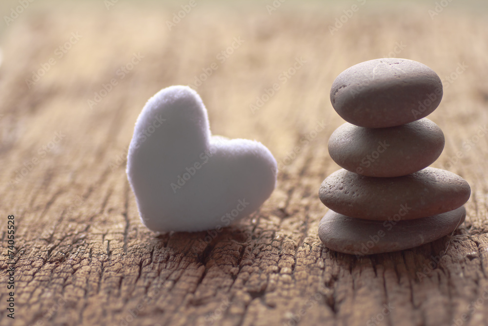 Zen stones and violet Heart on wooden - Stock Image Zen stones and violet Heart on wooden - Stock Image
