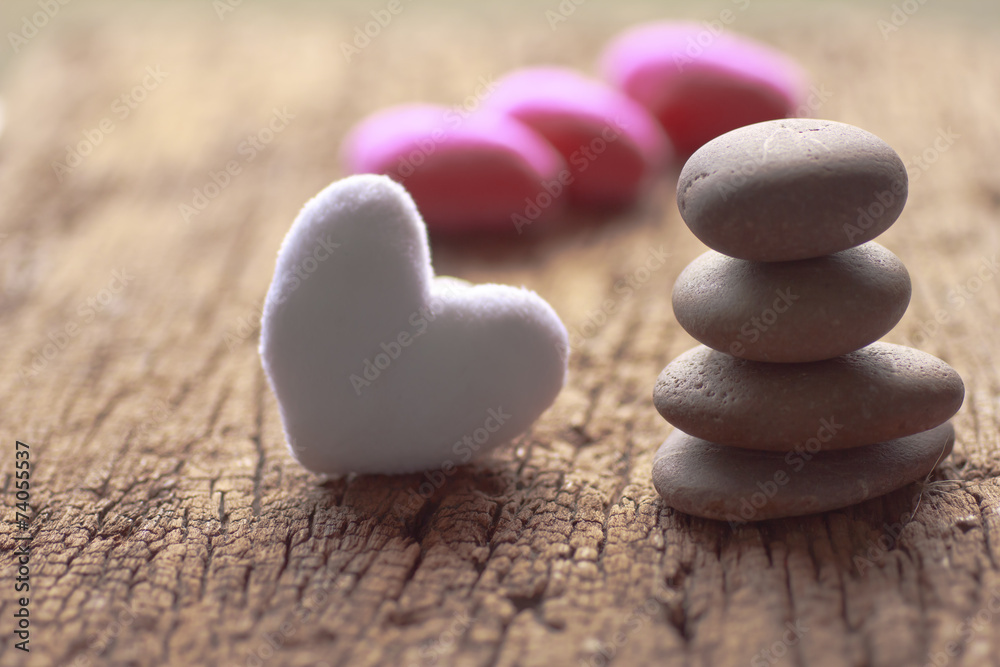 Zen stones and violet Heart on wooden - Stock Image Zen stones and violet Heart on wooden - Stock Image