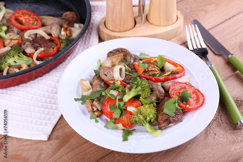 Braised wild mushrooms with vegetables and spices in pan and