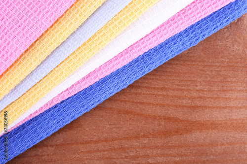 Colorful napkins on wooden table