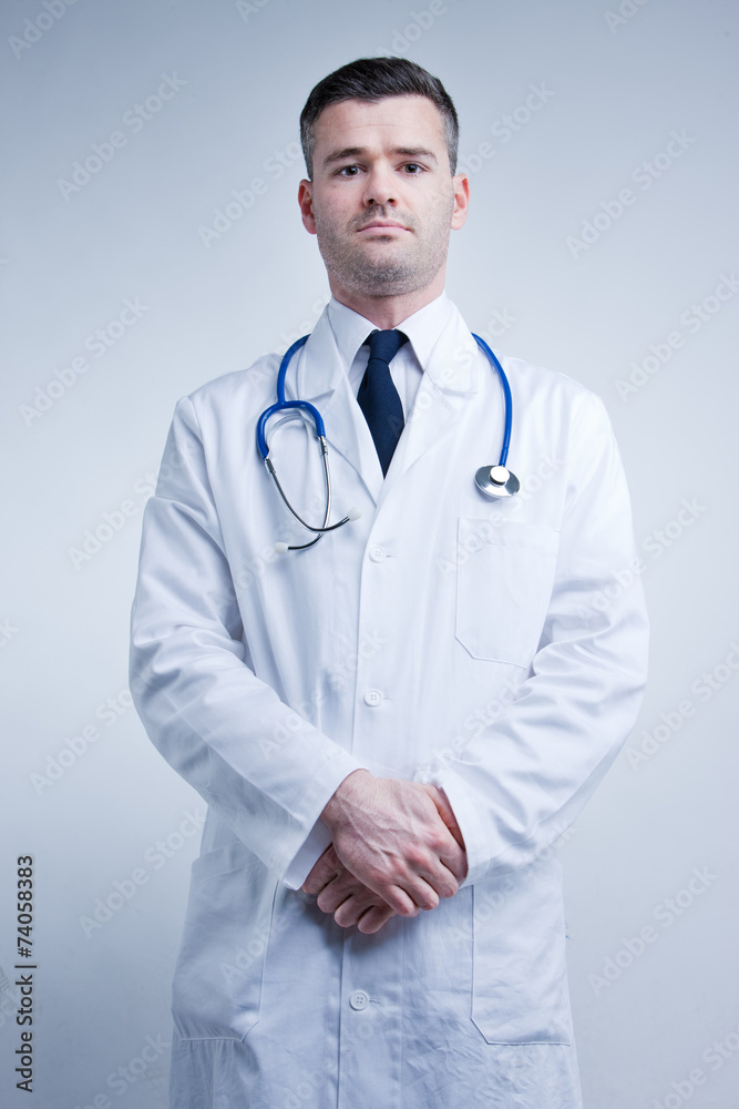 self confident available doctor in white coat self confident available doctor in white coat