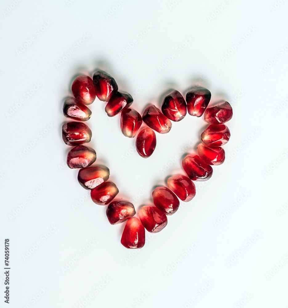 Heart of pomegranate seeds isolated on white background Heart of pomegranate seeds isolated on white background