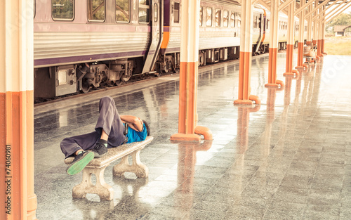 man sleep in Passenger platform at  the railway station © coffmancmu