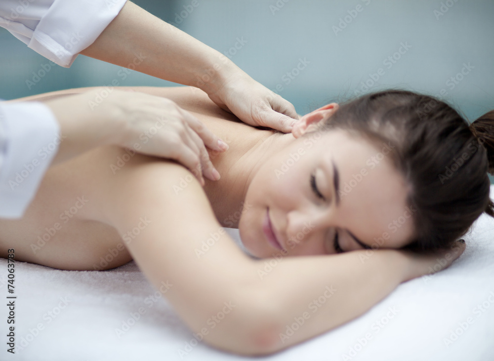 Young woman getting a massage in a spa Young woman getting a massage in a spa