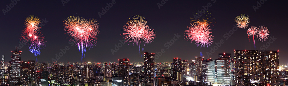 Fireworks celebrating over Tokyo cityscape at night Fireworks celebrating over Tokyo cityscape at night