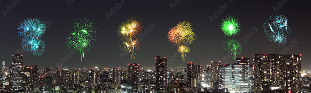 Fireworks celebrating over Tokyo cityscape at night Fireworks celebrating over Tokyo cityscape at night